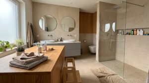 Family-friendly modern bathroom in Stuttgart with shower, double sink and clever bathroom renovation ideas for small spaces